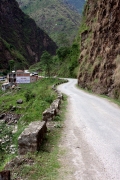 A road winds through the Himalayan Mountains close to the Chinese border in Nepal. 